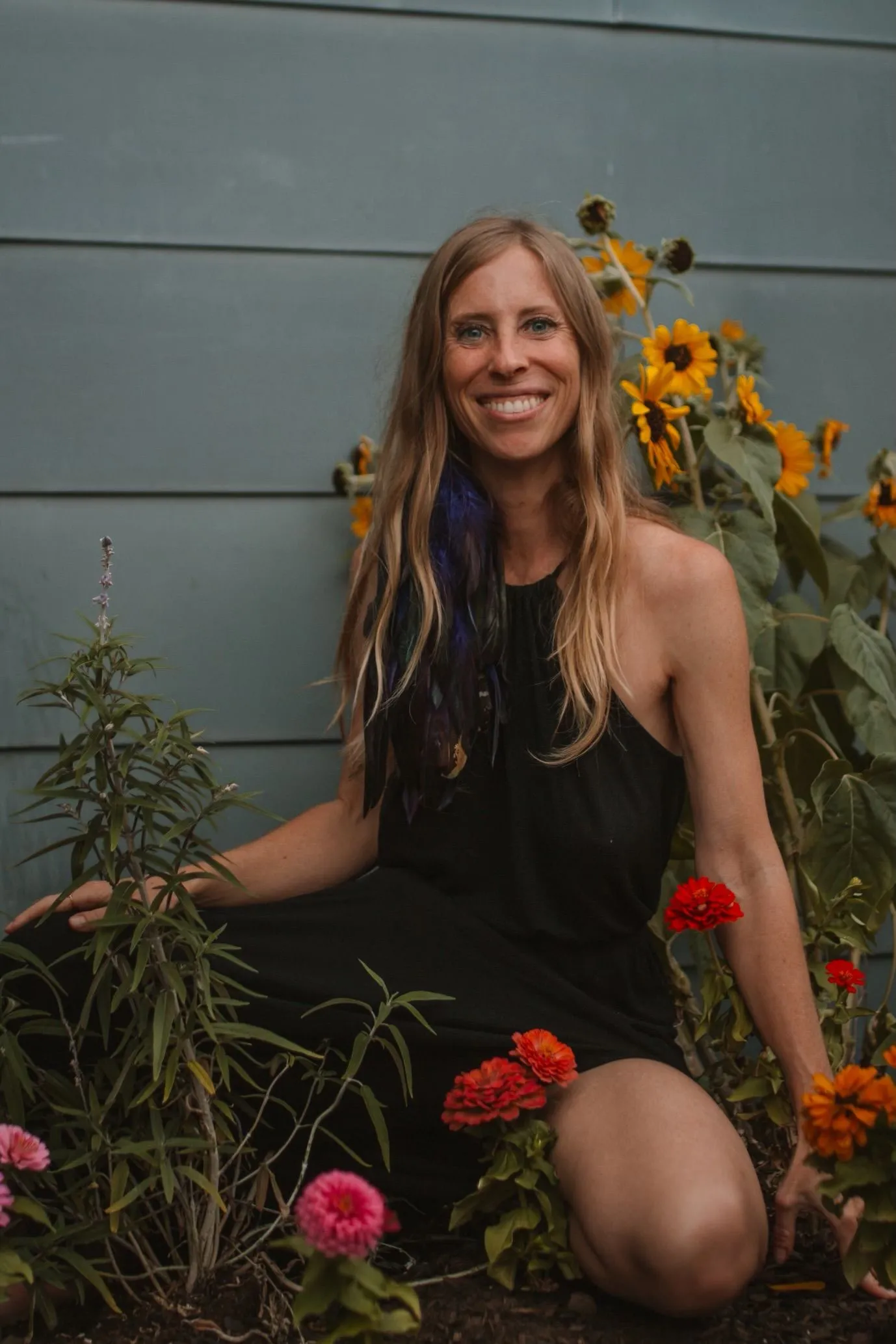 Kelci Heart in a sunflower garden