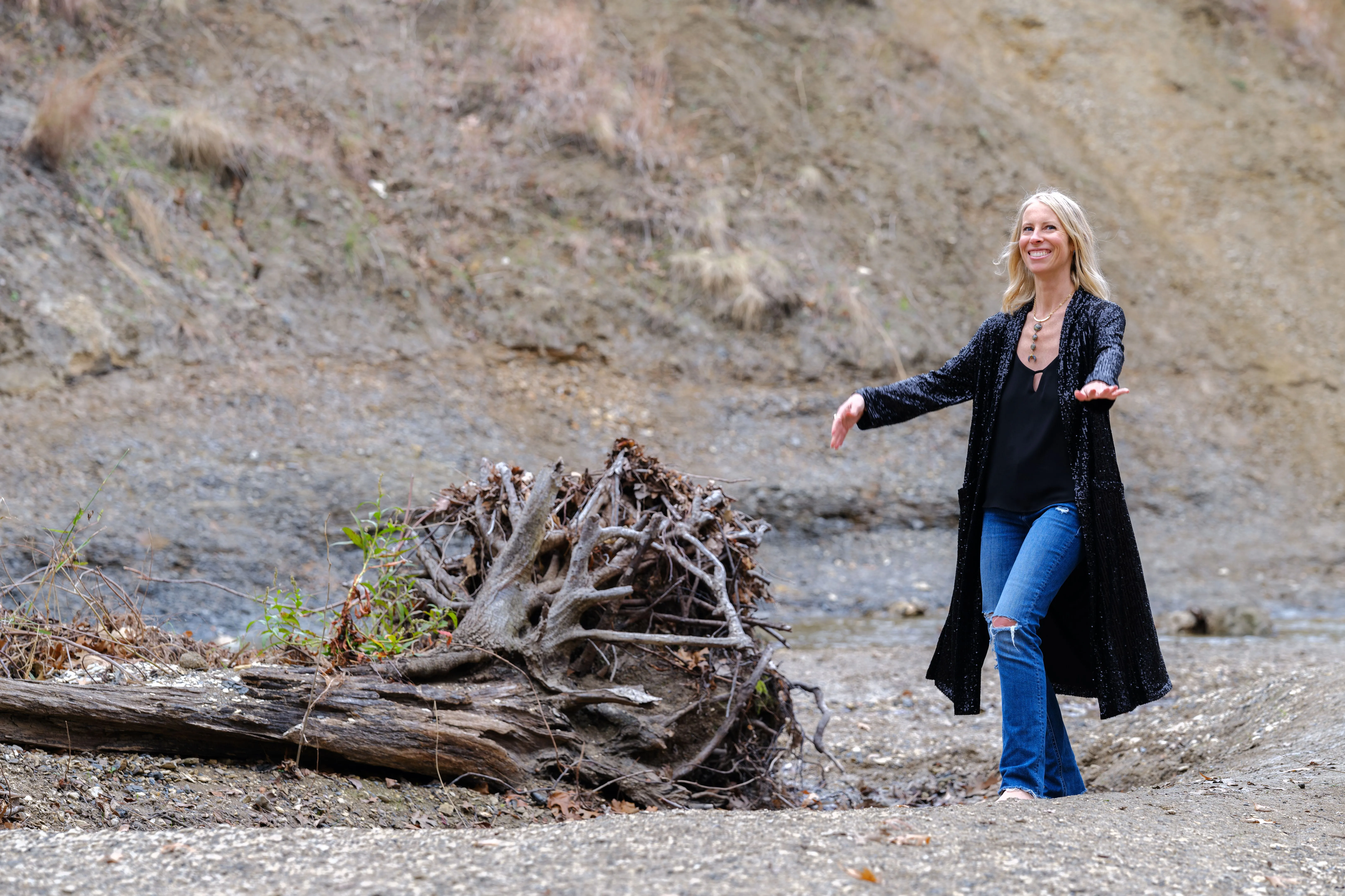 Kelci Heart dancing by a tree